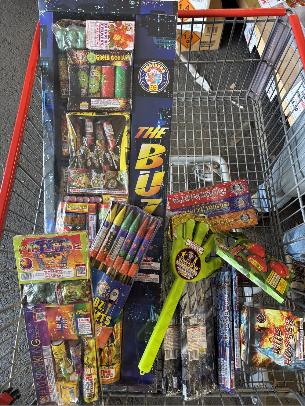 A shopping cart loaded with consumer fireworks