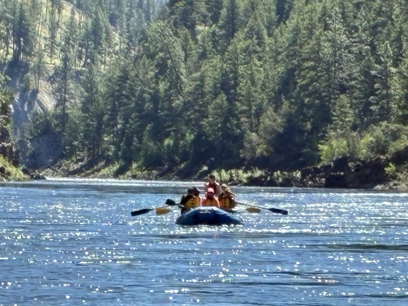 A raft small against the canyon walls of the Clark Fork